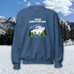 charleston peak hiking sweatshirt unisex hiker standing on summit waving poles 11916 ft mt charleston nevada mountain hike design